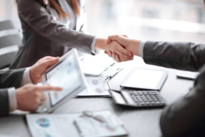 close up.Businessman showing on digital tablet, with financial data.